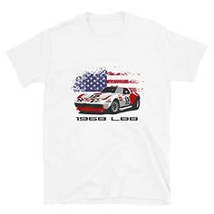 a white t - shirt with an american flag on it and a race car in the background