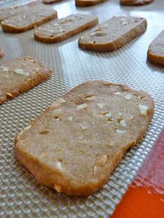 some cookies are sitting on a cookie sheet and ready to be baked in the oven