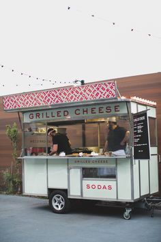 the food cart is parked in front of a building