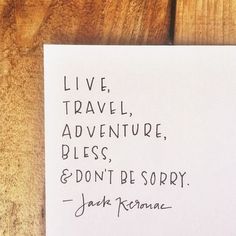 a piece of paper with the words live travel, adventure, bliss and don't be sorry written on it