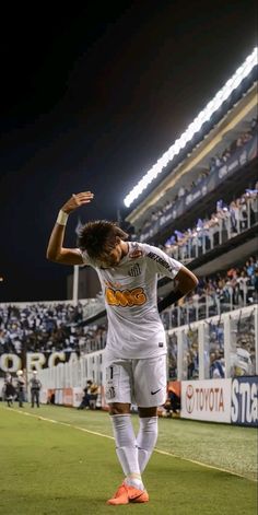 a man standing on top of a soccer field