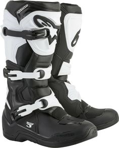 a pair of black and white motorcycle boots