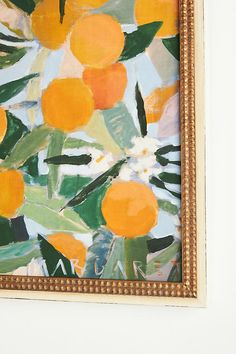 an orange painting is hanging on the wall