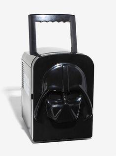 a darth vader mask on top of a black suitcase