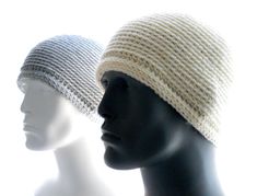 three mannequin heads wearing knitted hats