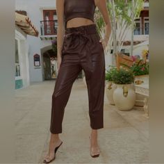 Commando Faux Leather Paperbag Pants In Oxblood Commando's Faux Leather Paperbag Pant Is Made From Our Signature Four-Way Stretch Faux Leather And Designed With A Relaxed Fit And Tapered Leg. Topped With A High, Paperbag Waist And Removable Tie Belt, These Pants Are A Stylish Addition To Any Wardrobe. Waist 14” Flat Across Rise 14” Inseam 26.5” New With Tags Patent Leather Leggings, Snakeskin Leggings, Sequin Leggings, Tank Jumpsuit, Cropped Flare Pants, Leather Joggers, Black Faux Leather Leggings, Paperbag Pants, Velvet Leggings