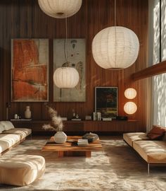 a living room filled with furniture and hanging lights