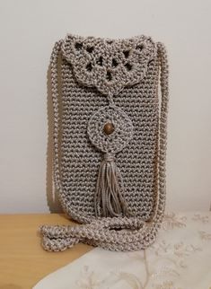 a crocheted purse sitting on top of a table