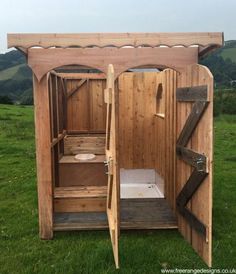 a wooden outdoor sauna with the door open