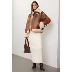 Brown faux leather (100% Polyester). Jacket. Long sleeves. Collar. Front zipper closure. 25" from shoulder to hemline. Imported. Spring Workwear Leather Jacket With Faux Fur Trim, Spring Leather Jacket With Faux Fur Trim, Brown Leather Jacket With Zip Cuffs For Work, Chic Cropped Jacket With Faux Fur Trim For Fall, Chic Leather Jacket With Padded Collar, Fall Cropped Jacket With Zipper Closure, Fall Leather Long Sleeve Cropped Jacket, Leather Cropped Jacket With Long Sleeves For Fall, Chic Brown Outerwear With Zipper Closure