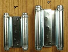 three different types of metal door hinges on a wooden surface with measurements for each one