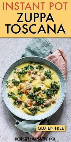 a bowl of soup with spinach, potatoes and meat in it on top of a table