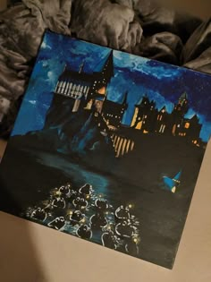 a painting of hogwarts castle on a bed