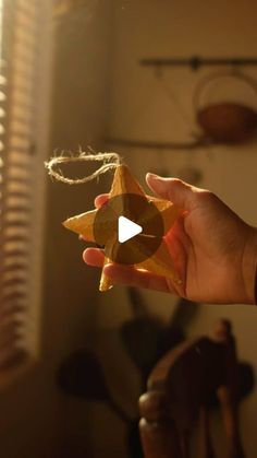 a person holding a star shaped object in their hand