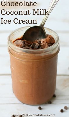 chocolate coconut milk ice cream in a glass jar with a spoon sticking out of it