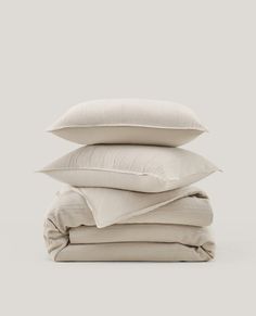 four pillows stacked on top of each other