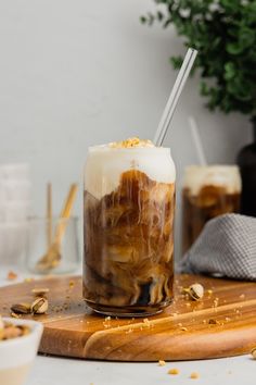 there is a drink with ice and caramel on the table