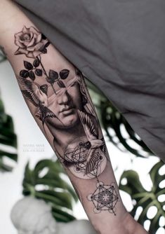 a person with a tattoo on their arm holding a rose and an image of a woman's face