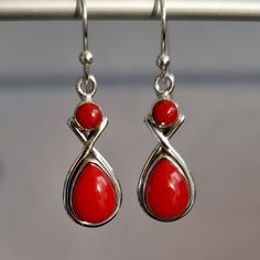 💖  Product Description Synthetic Coral Earrings - Two Stone Teardrop Coral Earrings set in 925 Sterling Silver.  Please note that these are synthetic Coral Stones and not real. 💖 Product Details *  925 Sterling Silver *  Handmade *  Total Drop from top of Hook to base of Earring - 36mm *  Width at the widest point - 10mm *  Depth - 5mm *  Weight - 5g *  Stone Size - Round 4mm, Teardrop 10mm x 8mm 💖  Packaging All items come in a pretty little gift bag made from Recycled saris.  If your earrings are a gift, then please do advise of colour preferences and we will do our best to send out a colour of choice.  For gemstone earrings, we do try and match the colour of the bag with the corresponding gemstone piece ordered.  Great bags to store the earrings in when not wearing them. 💖  Processi Red Coral Earrings, Christmas Jewellery, Teardrop Dangle Earrings, Coral Stone, Coral Earrings, Red Gemstones, 925 Silver Earrings, Christmas Jewelry, Earrings Set