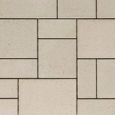 a close up view of a white brick wall