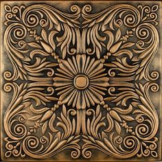 an intricately designed metal tile with swirls and leaves