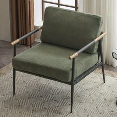 a green chair sitting on top of a rug