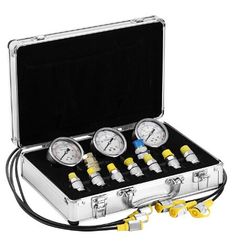 four gauges in a metal case with yellow handles and two hoses connected to each other