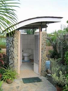 an outdoor shower in the middle of a garden