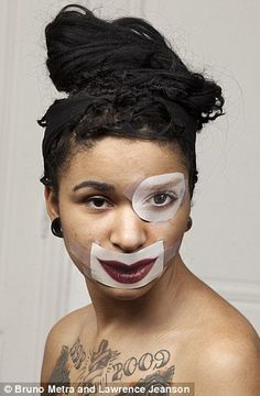 a woman with white face paint on her face