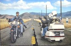 two people riding motorcycles on the road with mountains in the background