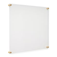 a white board with gold handles on it