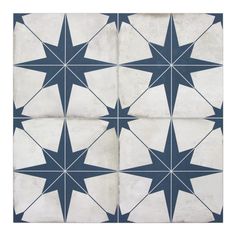 a blue and white tile design with stars on the bottom, in three different directions