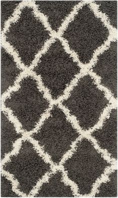 a black and white rug with squares on it