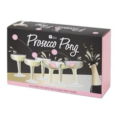 three champagne flutes in a box with pink and white confetti on the top