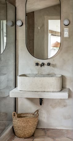 a bathroom sink sitting under a large mirror