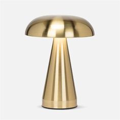 an image of a gold table lamp on a white background in the shape of a mushroom