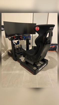 a racing simulator sitting on top of a tile floor