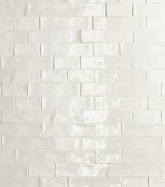 a white tiled wall with no one in it