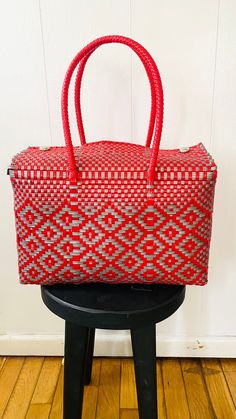 "Each bag begins in the small villages of Oaxaca, Mexico, handcrafted by creative and powerful artisans. Each bag is truly one of a kind piece. Featured in this listing is a silver and red  tote.  *Handwoven *One thick handle on each side of the bag for extra security  *Easy maintenance  *Eco-friendly *Reusable *Fashionable *Lightweight  *Waterproof *Durable Please feel free to email me if you have any questions. Thank you! Bag measurements: 13.5 W x 8\" H x 5.5\" D with a strap drop of 9\"." Red Handwoven Beach Bag For Shopping, Red Eco-friendly Shoulder Bag With Braided Handles, Bag Lunch, Eco-friendly Red Handwoven Shoulder Bag, Mexican Handbags Tote Bags, Mexican Plastic Woven Bags, Mexican Bag, Plastic Basket, Thank You Bags