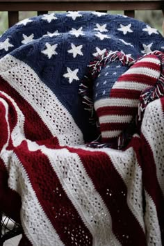 an american flag blanket on top of a chair