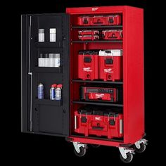 a red tool cabinet on wheels with tools in the bottom compartment and other items inside