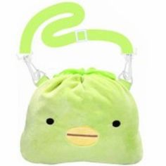 a green bag with a face on it