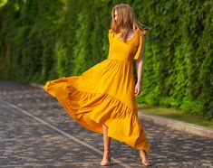 Yellow Long Dress For Summer, Long Yellow Summer Dress, Yellow Maxi Dress For Garden Party, Flowy Yellow Maxi Dress For Summer, Yellow Flowy Summer Maxi Dress, Yellow Flowy Maxi Sundress, Yellow Bohemian Floor-length Maxi Dress, Flowy Yellow Maxi Dress Floor-length, Yellow Flowy Floor-length Maxi Dress