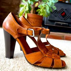 Gorgeous Italian Made Cole Haan Collection Brown Leather Sandals With Sexy 4" Heel. Size 9b, Fits Like 9.5/10. Lovely Leather Insole. Floor Model, Never Worn Outside Of Store. Excellent Condition, Some Floor Model Pen Marks Inside And On Sole And Some Marks On Soles From Stickers, Otherwise Like New. Please See Pics! Retro Summer Heels With Buckle Closure, Spring Vintage T-strap Sandals, Vintage Leather T-strap Open Toe Sandals, Vintage Leather T-strap Sandals With Open Toe, Retro T-strap Sandals For Spring, Chic Brown T-strap Heels, Brown T-strap Heels For Party, Spring T-strap Heels With 4-inch Heel, Vintage Stacked Heel Summer Heels