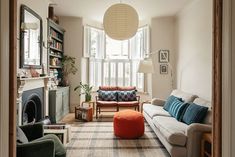 a living room filled with furniture and a fire place