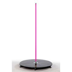 a pink light up stick on top of a black stand with a circular base in the middle