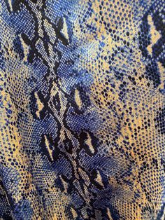 a blue and yellow snake skin print fabric