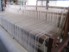 the loom is being worked on by someone