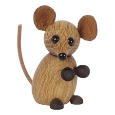 a wooden toy mouse sitting on top of a white surface