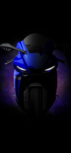 a blue motorcycle is shown in the dark